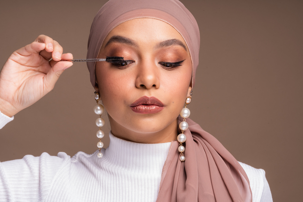 Muslim Woman Putting on Mascara 