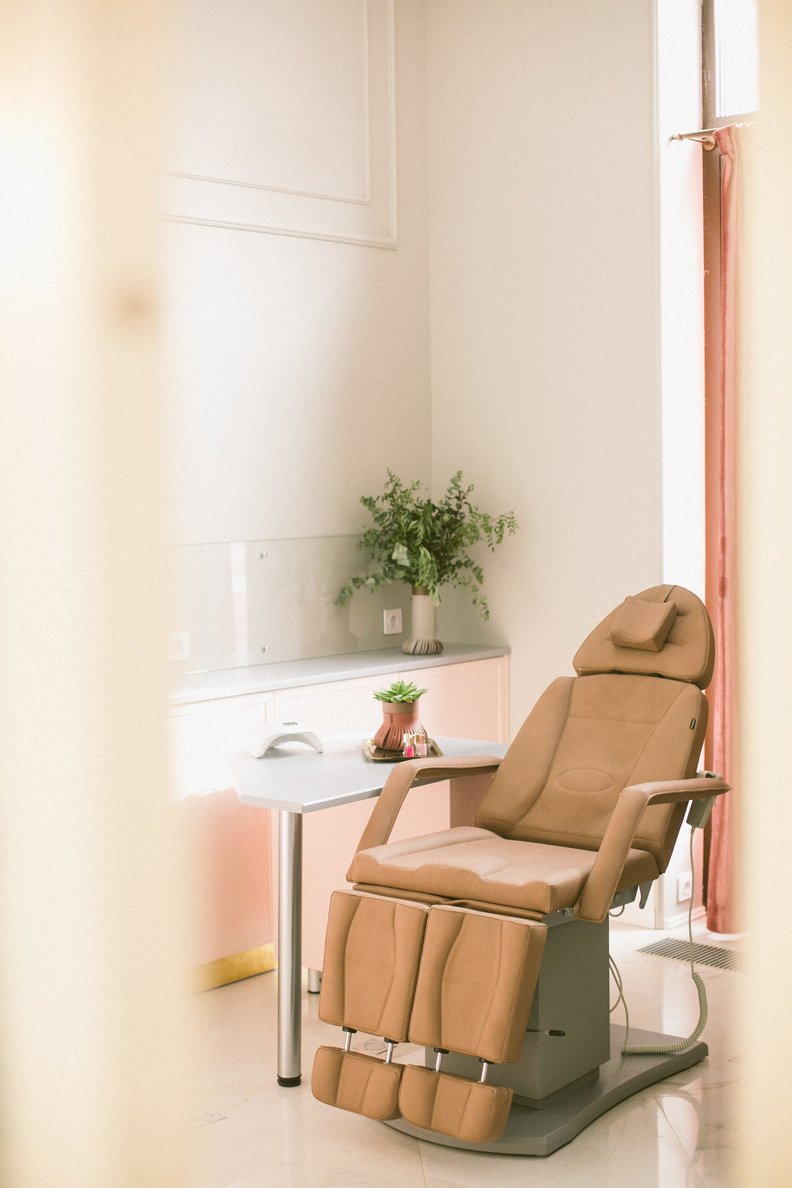 Modern treatment chair in bright beauty salon